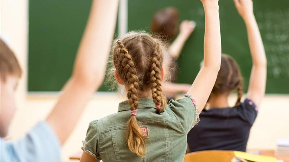Alumnos en el aula de un colegio.
